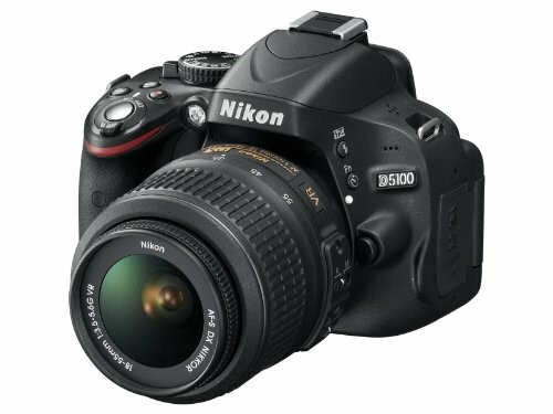 Nikon D5100 DSLR camera with lens.